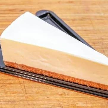 Romige cheesecake op een bodem van verkruimelde koek. Koud en stevig, precies goed na een burger.